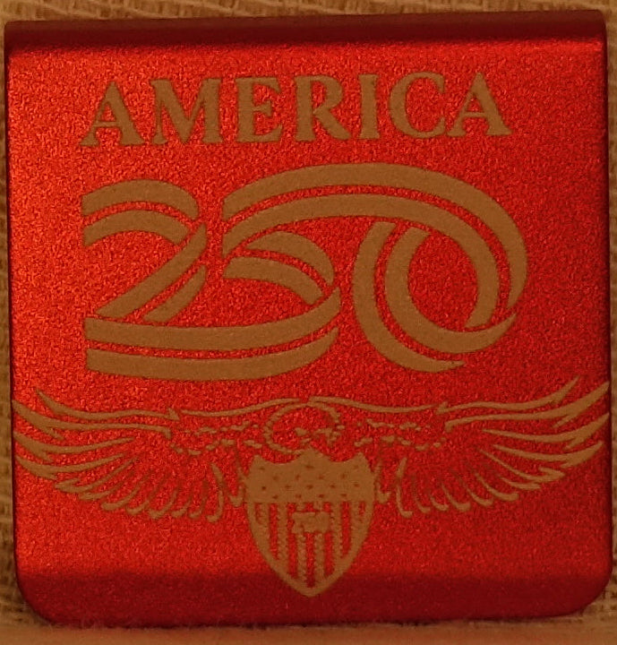 A square 1.25 aluminum hat clip featuring a lasered hand drawn eagle with the word 'AMERICA' and the number '250'. The clip has round corners.
