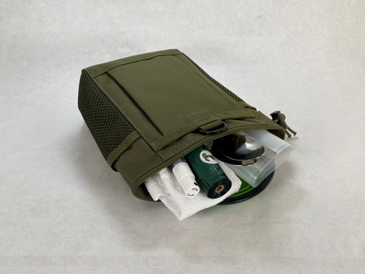  the Puppy Stroll Kit, a the green canvas bag with the included supplies: covered Spoons, micro cloth, roll of waste bags, silicone bag, sanitizer spray bottle, and a small collapsible drink cup