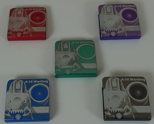 picture shows Five small Approx.1.25" square aluminum clip, you can accessorize your wardrobe with. there are seven different designs on our store this one shows a square A-10 Warthog composition, each in a different color: red, purple, green, blue, and gray. The items feature a pencil drawn image that has been lasered on the aluminum clip and the text 'A-10 Warthog'.